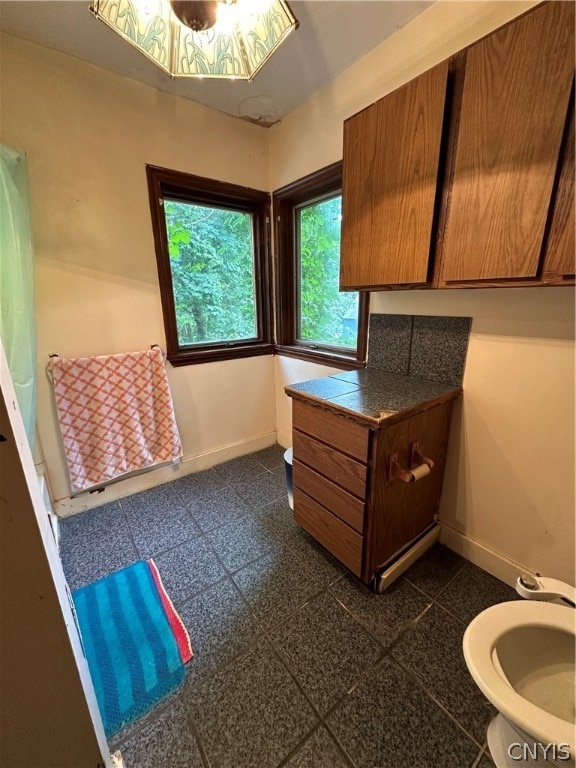 bathroom with tile patterned floors and vanity