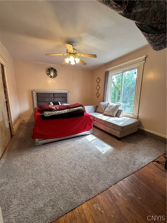 interior space with ceiling fan and hardwood / wood-style flooring