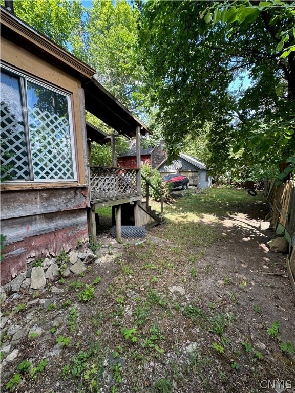 view of yard featuring a wooden deck