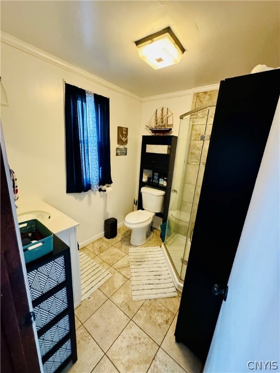 bathroom featuring tile patterned flooring, toilet, and ornamental molding