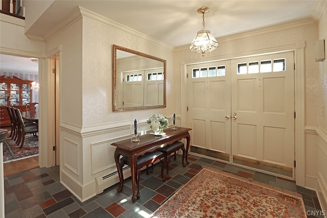 foyer with a notable chandelier, a baseboard heating unit, crown molding, and dark wood-type flooring