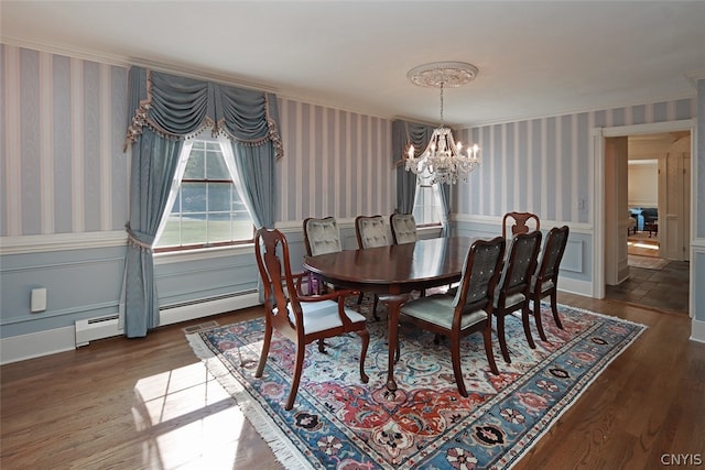 dining room with an inviting chandelier, dark hardwood / wood-style floors, and a baseboard heating unit