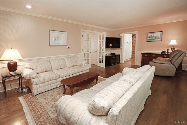 living room with wood-type flooring and crown molding