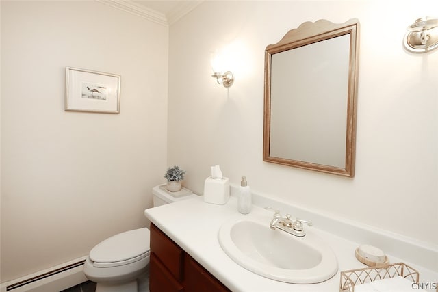 bathroom with vanity, crown molding, a baseboard heating unit, and toilet