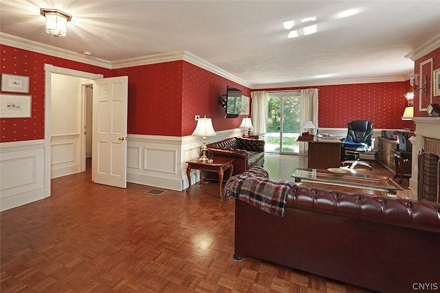 living room with parquet flooring, a brick fireplace, and ornamental molding