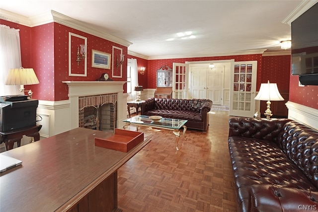 living room featuring ornamental molding, a brick fireplace, and parquet flooring