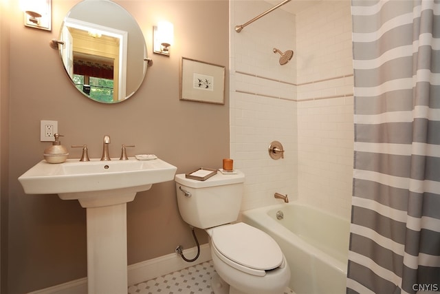 bathroom featuring shower / bathtub combination with curtain, toilet, and tile patterned floors