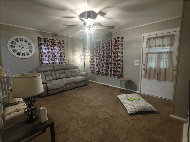 carpeted living room featuring ceiling fan and ornamental molding