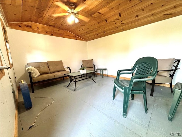 living area with wood ceiling, vaulted ceiling, concrete flooring, and ceiling fan