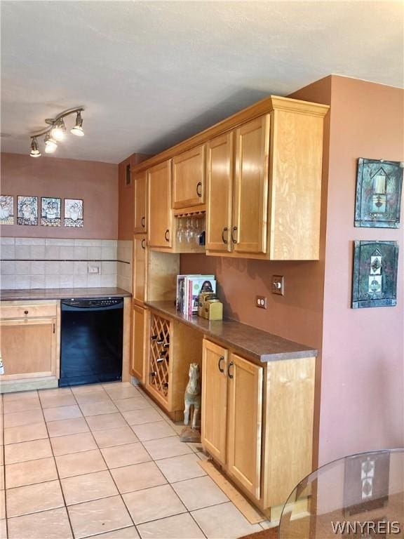 kitchen featuring backsplash, dark countertops, dishwasher, and light tile patterned flooring