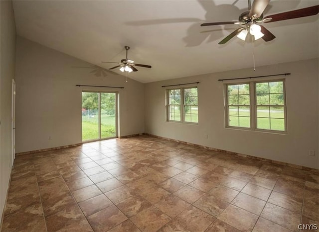 tiled spare room with lofted ceiling, ceiling fan, and a healthy amount of sunlight