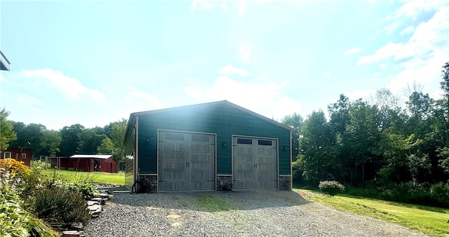 view of outbuilding featuring a garage