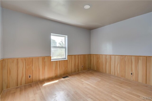 spare room featuring light wood-type flooring