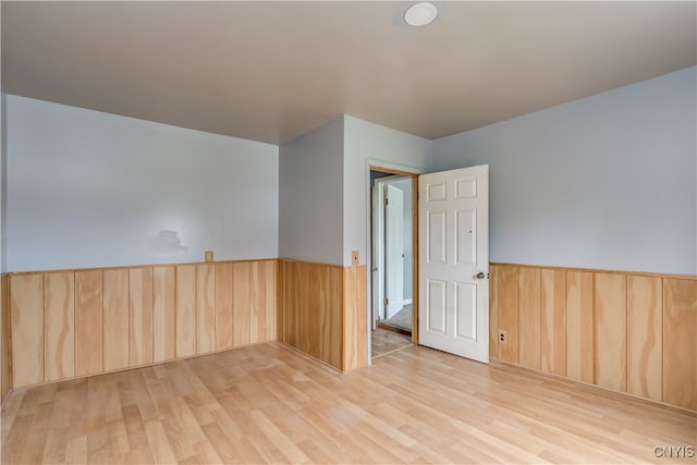 spare room featuring light hardwood / wood-style flooring