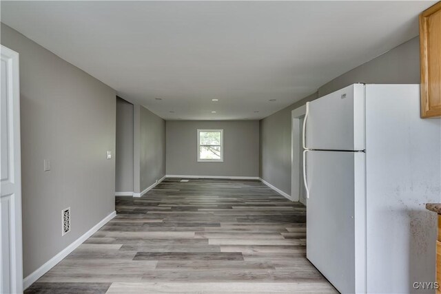 kitchen featuring white fridge and light wood-type flooring