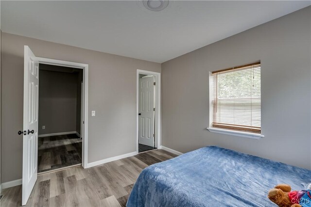 bedroom featuring hardwood / wood-style flooring