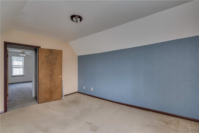 bonus room featuring carpet floors, ceiling fan, and vaulted ceiling