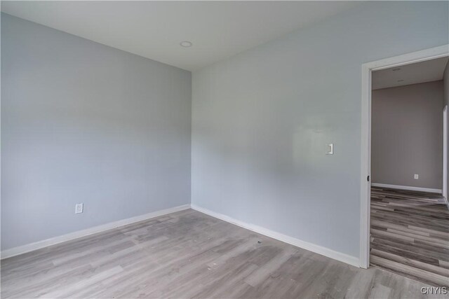 spare room featuring light hardwood / wood-style floors