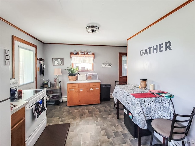 kitchen featuring light countertops, electric range, stone finish floor, and crown molding