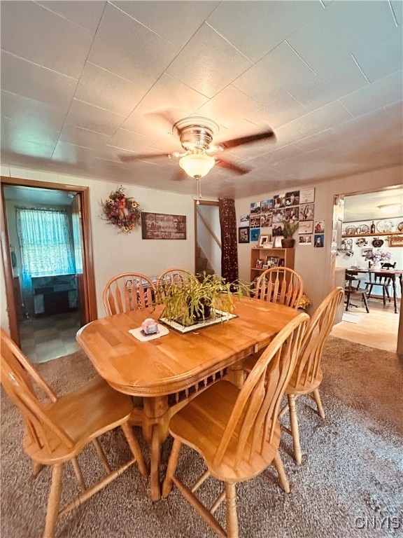 dining room featuring carpet and ceiling fan