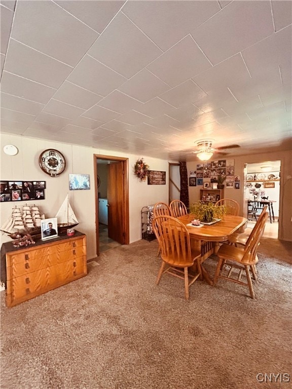 view of carpeted dining space