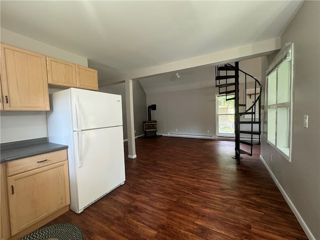 kitchen featuring dark wood-type flooring, white refrigerator, and light brown cabinets