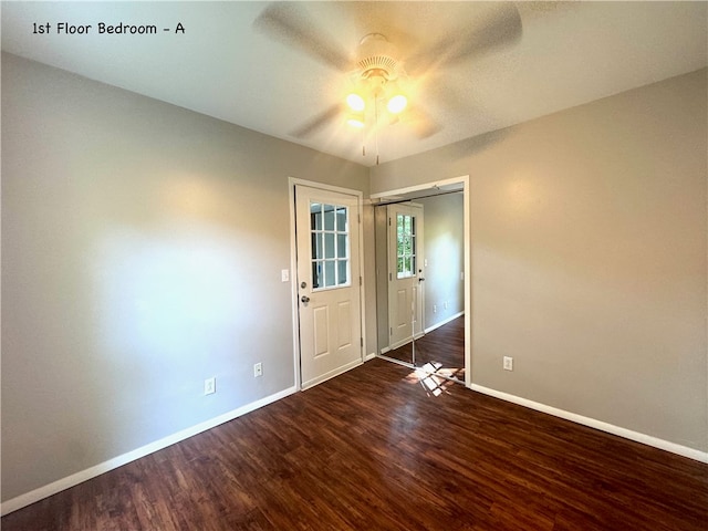 unfurnished bedroom with ceiling fan, wood-type flooring, and a closet