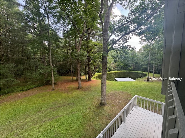 view of yard with a wooden deck