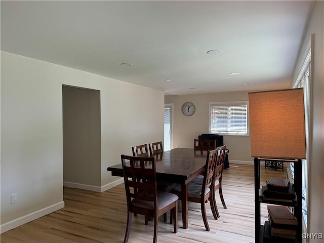 dining area with hardwood / wood-style floors