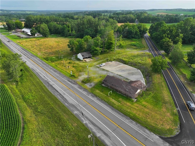 birds eye view of property with a rural view