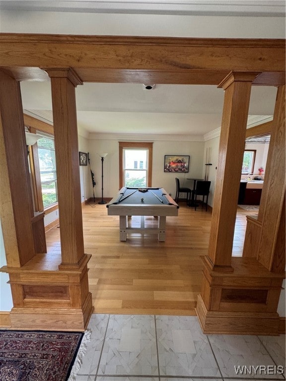 playroom with beam ceiling, light wood-type flooring, pool table, ornate columns, and ornamental molding