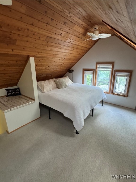 unfurnished bedroom with light carpet, wood ceiling, and ceiling fan