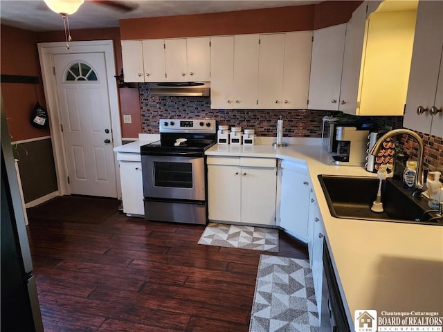 kitchen with sink, backsplash, white cabinetry, dark wood-type flooring, and stainless steel electric stove