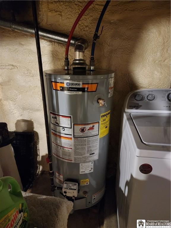 utility room featuring gas water heater and washer / clothes dryer
