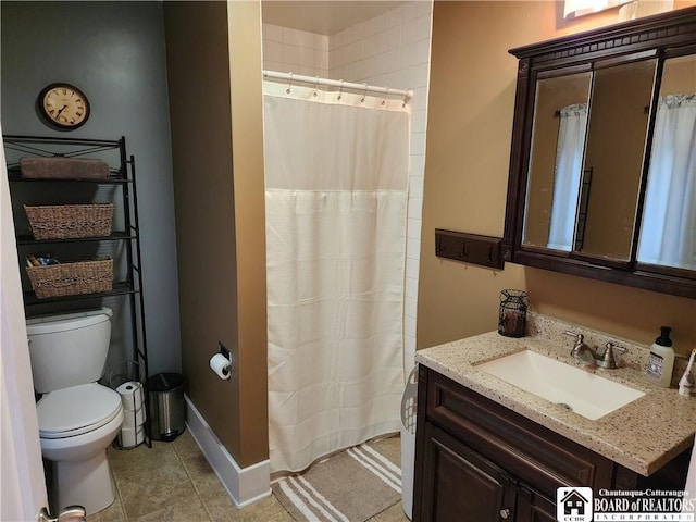 bathroom with vanity, a shower with shower curtain, toilet, and tile patterned flooring