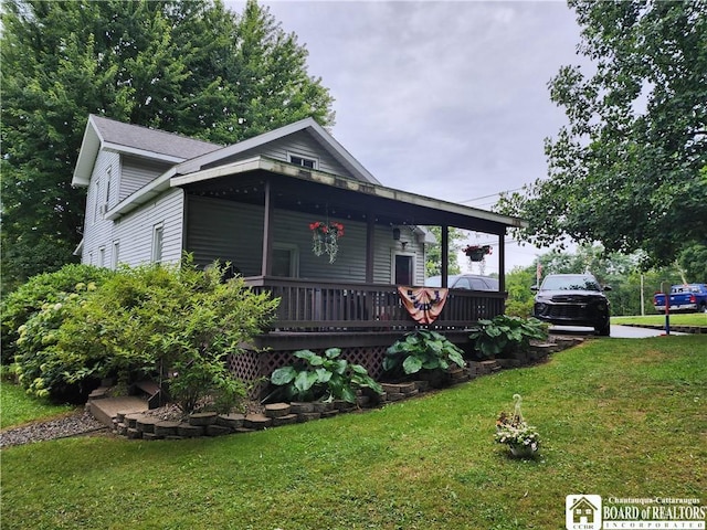 view of front of property with covered porch and a front lawn