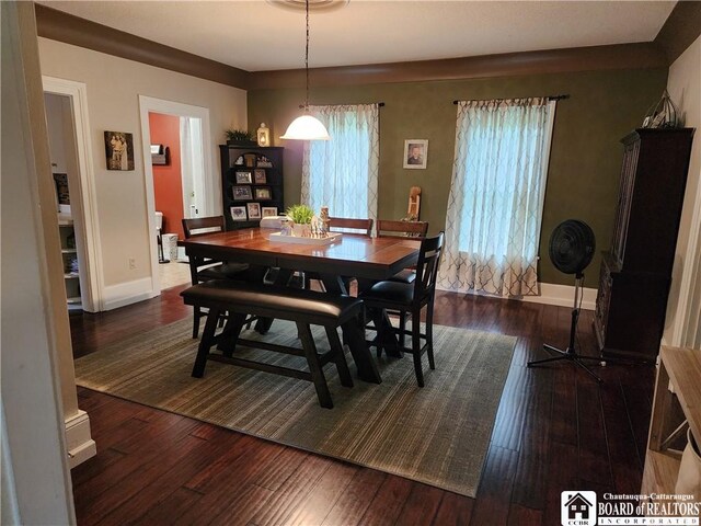 dining space featuring dark hardwood / wood-style floors
