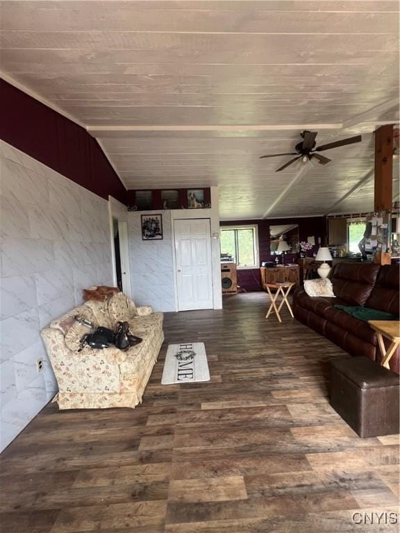 living room featuring vaulted ceiling, dark wood-type flooring, and ceiling fan