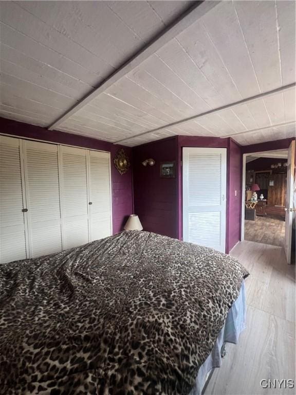 bedroom featuring light hardwood / wood-style flooring and a closet