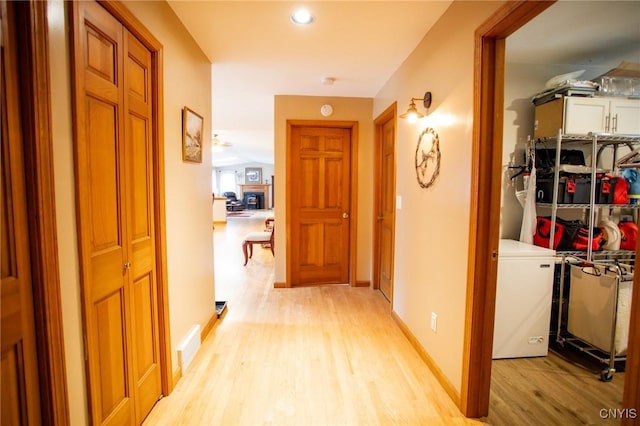 corridor featuring light hardwood / wood-style flooring