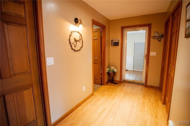 hallway with light wood-type flooring