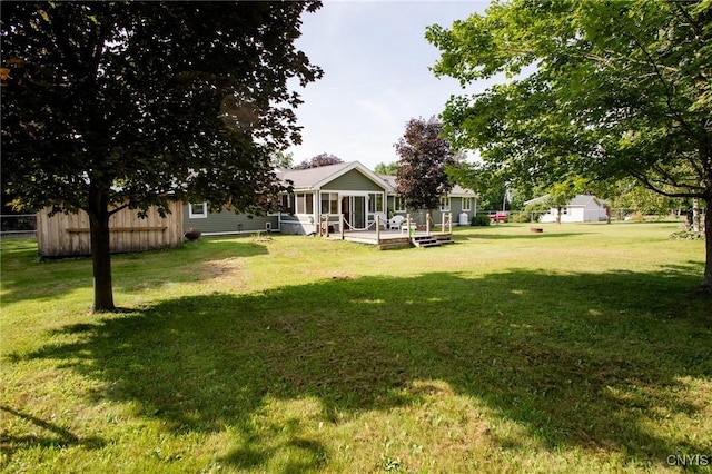 view of yard featuring a wooden deck