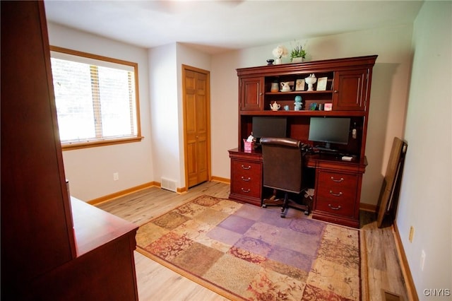 office space with light hardwood / wood-style flooring