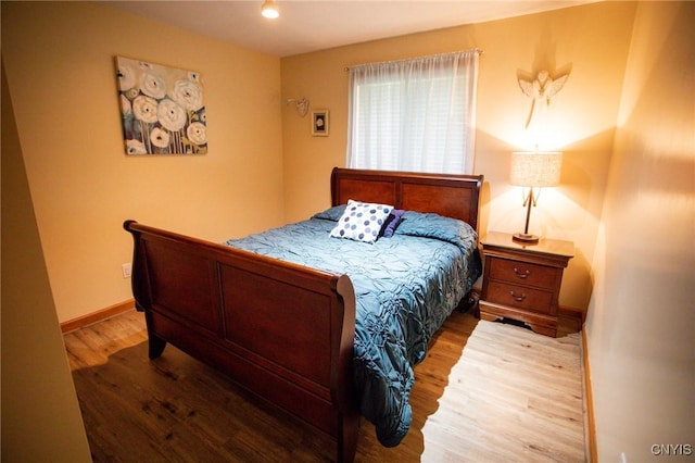 bedroom with wood-type flooring