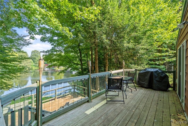 wooden deck with a water view