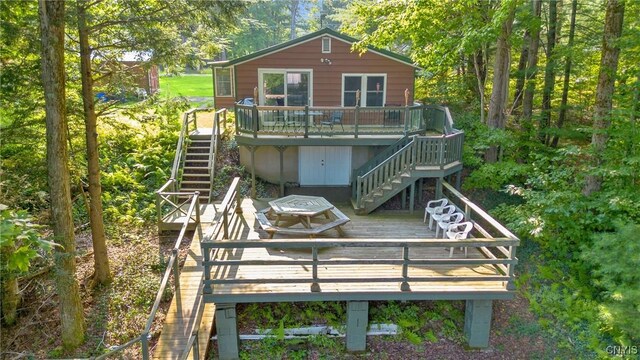 back of house with a wooden deck