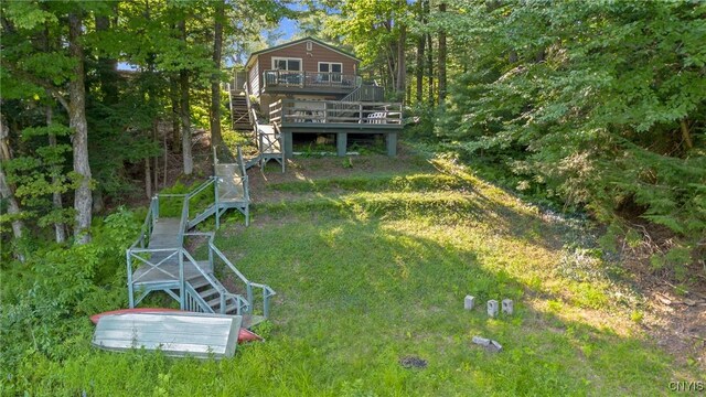 view of yard with a wooden deck