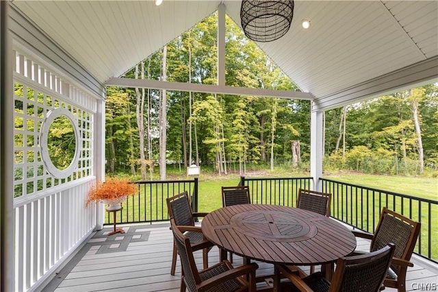 wooden terrace with a yard