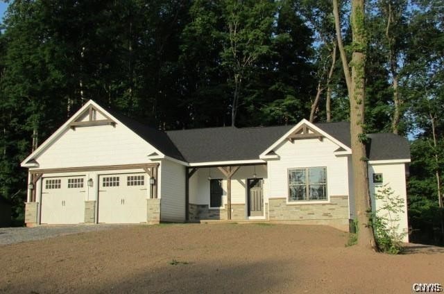 craftsman inspired home with a garage