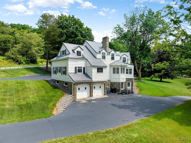 view of front of property featuring a garage and a front yard